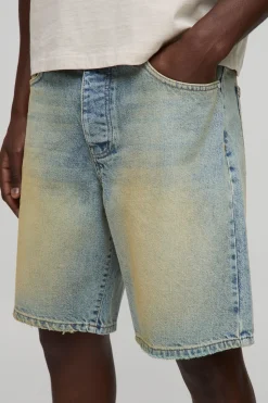 Shorts en denim à coupe décontractée, extrême délavé avec finition à l'ourlet brut