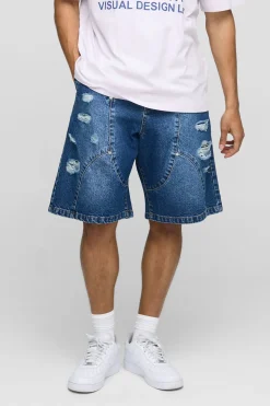 Shorts en denim délavé style parachute avec panneaux déchirés