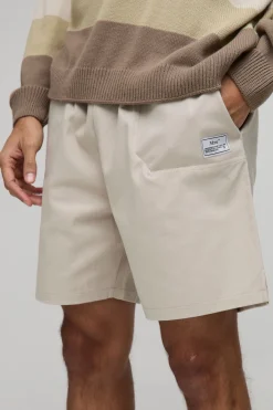 Shorts en toile à taille élastiquée, coupe décontractée avec onglet tissé