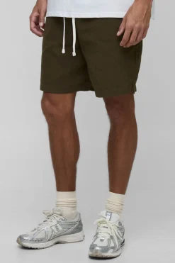 Shorts taille haute à ceinture élastiquée, coupe ample et ourlet fendu