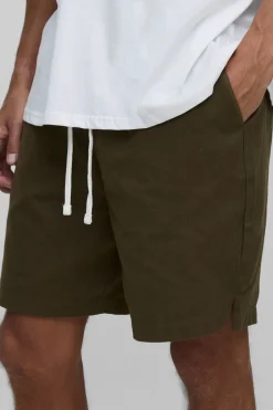 Shorts taille haute à ceinture élastiquée, coupe ample et ourlet fendu
