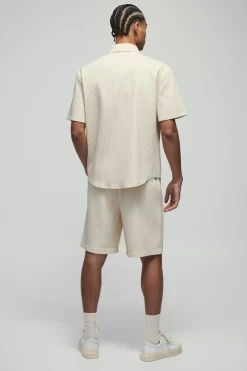 Short technique oversize plissé à ceinture partiellement fixe