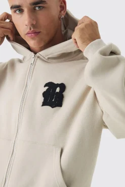 Sweat à capuche ample zippé à écusson B