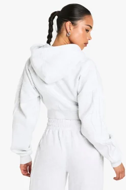 Sweat à capuche court à la coupe boxy avec zip intégral et détails de couture