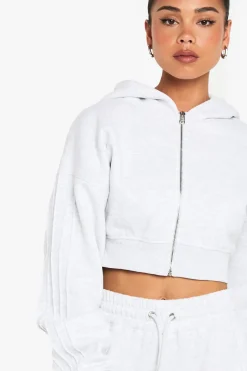 Sweat à capuche court à la coupe boxy avec zip intégral et détails de couture