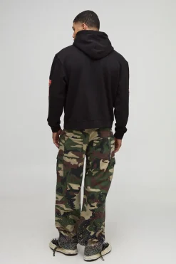 boohooMAN Sweat à capuche surdimensionné à coupe boxy, imprimé de strass "Hustle Slot Machine"<Homme Sweats À Capuche Et Sweatshirts|Sweats À Capuche Et Sweats