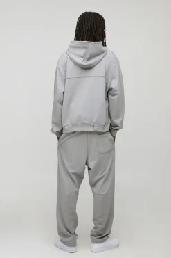 Sweat à capuche oversize, coupe boxy, en maille loopback avec inscription "MAN" en script, brodé et panneau côtelé