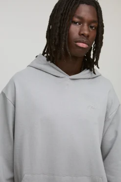 Sweat à capuche oversize, coupe boxy, en maille loopback avec inscription 