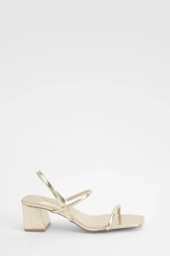 Talons compensés métalliques à bride arrière pour pieds larges