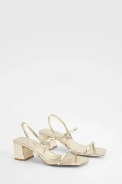 Talons compensés métalliques à bride arrière pour pieds larges