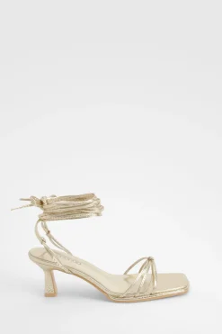 Talons métalliques à lanières effet croc et coupe large
