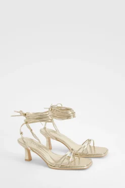 Talons métalliques à lanières effet croc et coupe large