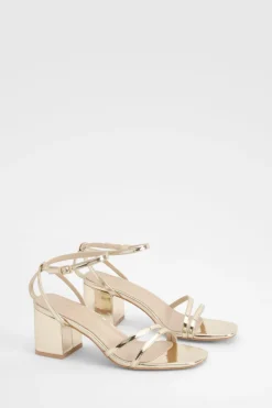 Talons métalliques à talon bloc bas, asymétriques et à peine perceptibles