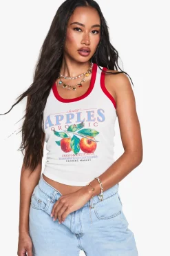 Top court sans manches en maille côtelée avec empiècement contrasté et imprimé graphique de pommes