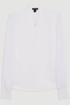 Top en maille à effet bandage, détail zip et manches en chiffon