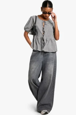 Top smock en gingham avec nœud à l'avant et manches bouffantes