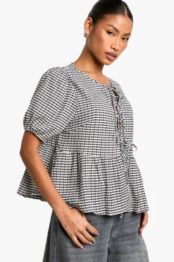 Top smock en gingham avec nœud à l'avant et manches bouffantes