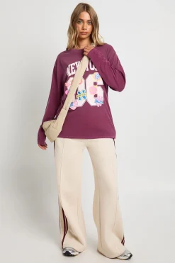T-shirt à manches longues oversize imprimé dans le style varsity avec autocollants