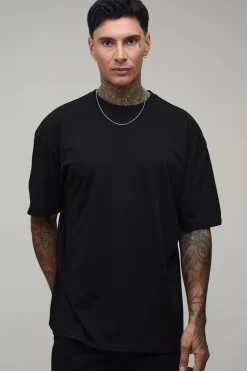 T-shirt Noir Oversize Tall À Imprimé Worldwide Sur Les Coutures