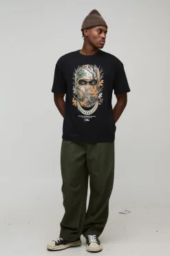 T-shirt noir surdimensionné à col étendu avec imprimé masque de ski