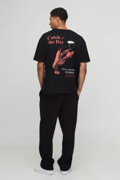 T-shirt noir surdimensionné imprimé avec licence Guinness