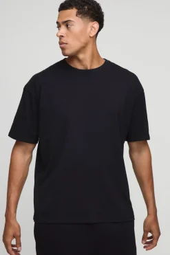 T-shirt noir surdimensionné imprimé avec licence Guinness