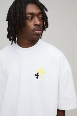 T-shirt oversize à la coupe boxy et orné d'une broderie en croix
