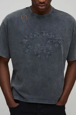 T-shirt rétréci à coupe boxy, délavé, orné d'appliqués, en tissu épais et avec un effet vieilli