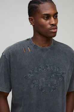 T-shirt rétréci à coupe boxy, délavé, orné d'appliqués, en tissu épais et avec un effet vieilli
