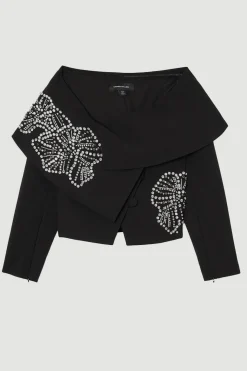 Veste asymétrique sur mesure ornée de cristaux floraux placés
