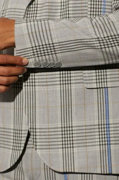 Veste à carreaux boxy surdimensionnée avec surpiqûres contrastées