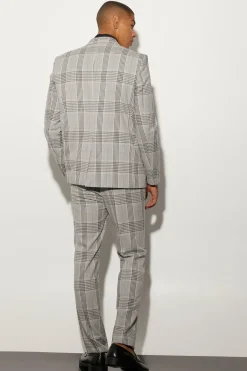 Veste à carreaux boxy surdimensionnée avec surpiqûres contrastées