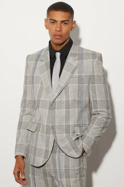 Veste à carreaux boxy surdimensionnée avec surpiqûres contrastées