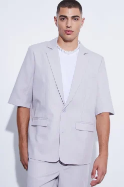 Veste de costume surdimensionnée à manches courtes et à simple boutonnage