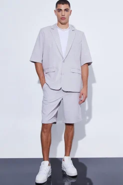 Veste de costume surdimensionnée à manches courtes et à simple boutonnage