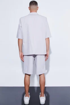 Veste de costume surdimensionnée à manches courtes et à simple boutonnage