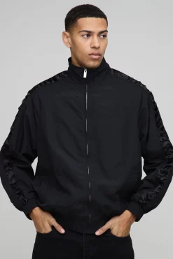 Veste de survêtement en nylon avec panneaux en satin, coupe régulière, manches froncées