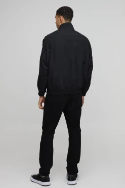 Veste de survêtement en nylon avec panneaux en satin, coupe régulière, manches froncées