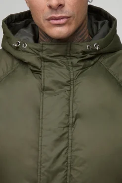 Veste doudoune longue à coupe surdimensionnée, à manches froncées et à panneaux