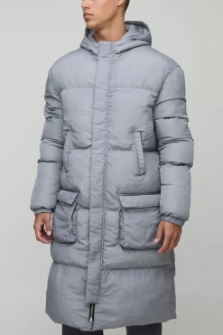 boohooMAN Veste doudoune longue pour grands à 4 poches, à capuche, en noir<Homme Tout Afficher|Vestes & Manteaux Tall