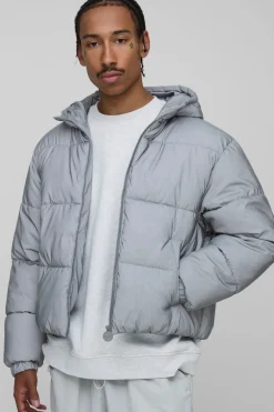Veste doudoune surdimensionnée à capuche, au style boxy, en tissu froissé et réfléchissant