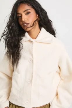 Veste effet laine à col boutonné avec détails de poches