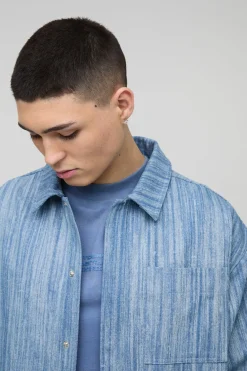 Veste en denim abstrait oversize à patte dissimulée