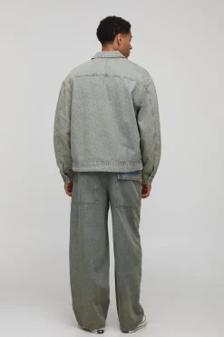 Veste en denim lavé à monogramme, surdimensionnée et à coupe carrée