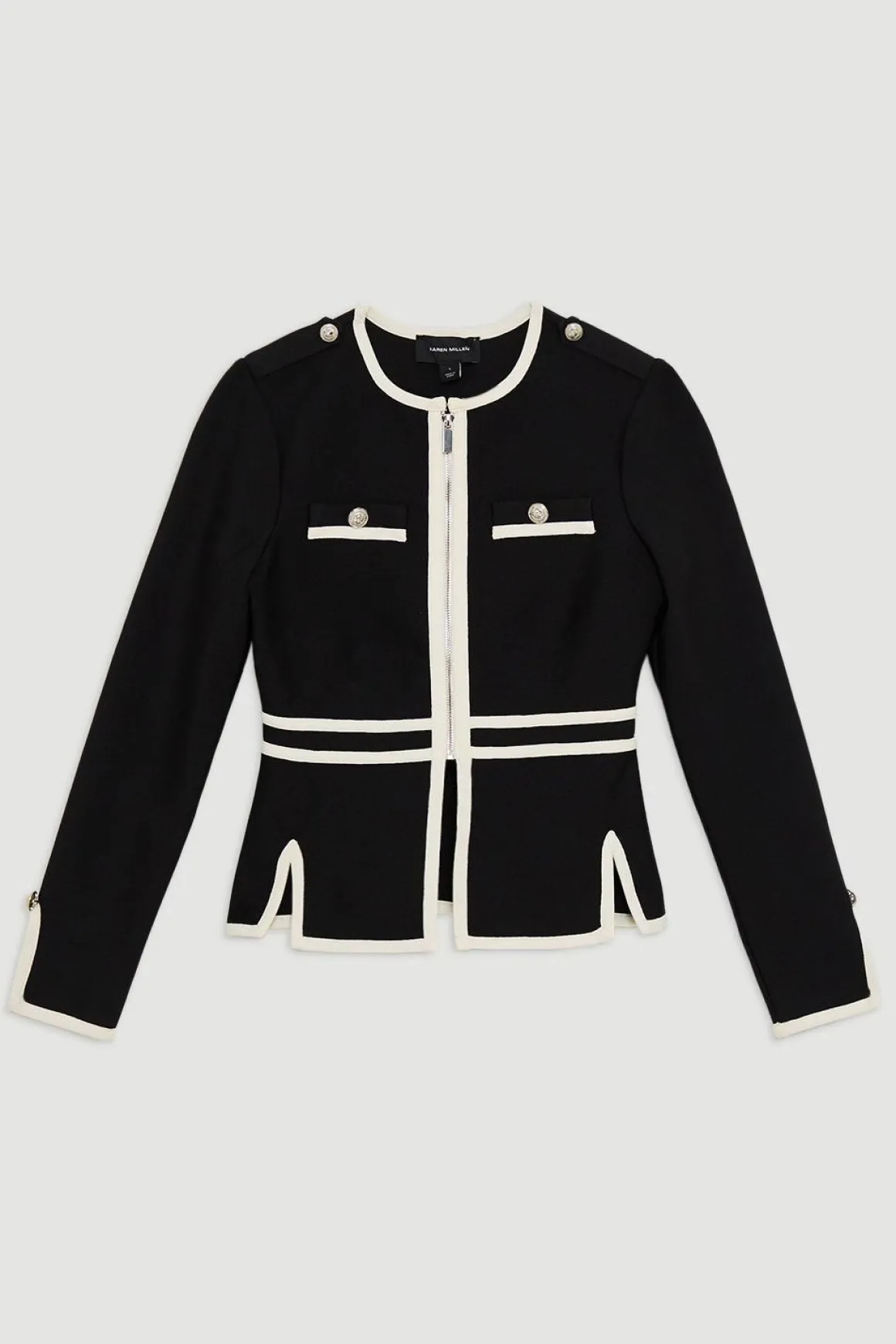 Veste en maille à ourlet fendu, effet bandage sculptant la silhouette, avec passepoils contrastés militaires.