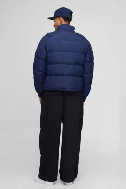 Veste matelassée à col cheminée, coupe régulière, manches raglan