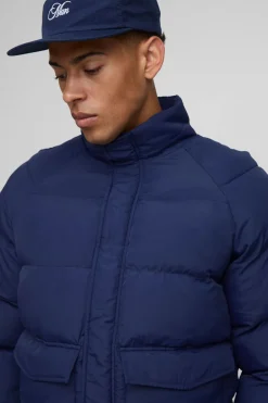 Veste matelassée à col cheminée, coupe régulière, manches raglan
