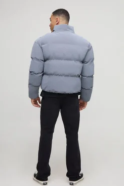 Veste matelassée à col entonnoir, coupe boxy, en synthétique caoutchoutée