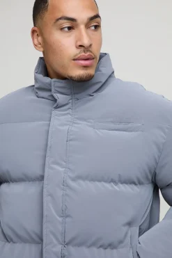 Veste matelassée à col entonnoir, coupe boxy, en synthétique caoutchoutée