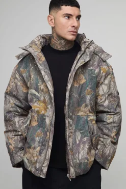 Veste matelassée longue, surdimensionnée, à capuche avec col entonnoir en camouflage forêt